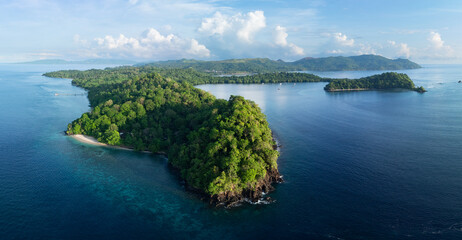 The scenic island of Bangka, just north of Sulawesi in Indonesia, is fringed by healthy coral reefs and mangroves. This area is part of the Coral Triangle and harbors astounding marine biodiversity.