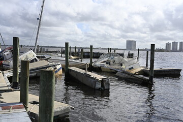 Severe hurricane damage - boats destroyed in a harbor.