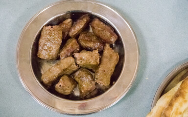Juicy Grilled Kusleme (Küşleme) Meat Pieces on a Metal Plate
