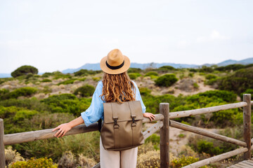 Happy woman- tourist enjoying beautiful views. Solitude with nature. Active lifestyle. Lifestyle,...