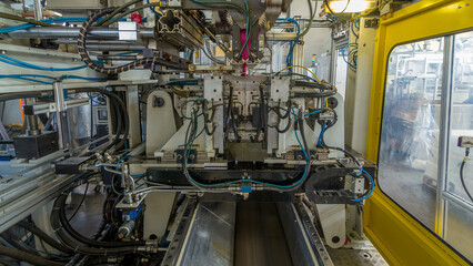 A factory for plastic canister production timelapse hyperlapse. The conveyor in the factory.