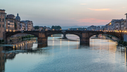 Obraz premium Ponte Santa Trinita Holy Trinity Bridge day to night timelapse over River Arno in Florence