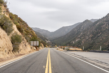 Granitic Rocks / Leucocratic Plutonic Rocks. intrusive / dikes. sheared and stained brown from iron oxides.( grdb ）. Angeles Crest Scenic Byway, Los Angeles County, California. San Gabriel Mountains. 