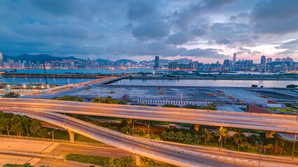 Fototapeta premium Hong Kong day to night, aerial view from kowloon bay downtown timelapse
