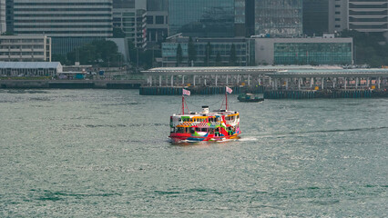Star Ferries and other ships are sailing through Victoria Harbour timelapse hyperlapse, with the...