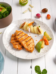 Tender, golden grilled chicken steak  and fresh seasoning. Ideal for healthy, delicious meals , With mashed potatoes, zucchini and carrots