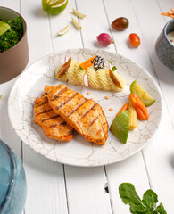 Tender, golden grilled chicken steak  and fresh seasoning. Ideal for healthy, delicious meals , With mashed potatoes, zucchini and carrots