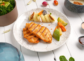 Tender, golden grilled chicken steak  and fresh seasoning. Ideal for healthy, delicious meals , With mashed potatoes, zucchini and carrots