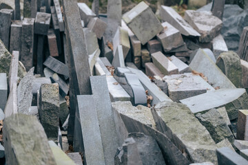 a pile of granite scraps and bigger pieces on pallets