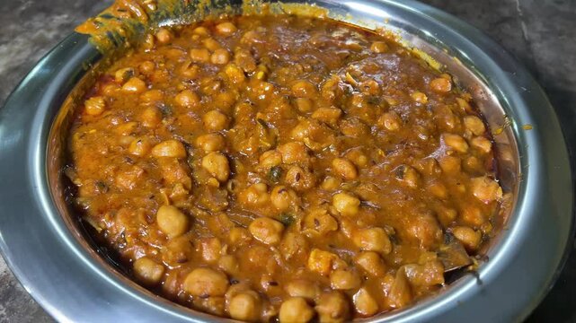Closeup shot of chhole masala with thick gravy.