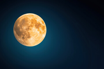 bright full moon shines against deep blue night sky, creating serene atmosphere