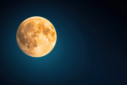 bright full moon shines against deep blue night sky, creating serene atmosphere