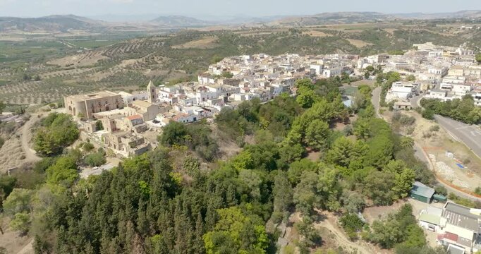 Aerial view of houses, apartments and buildings located in the historic center of the town of Bernalda, in the province of Matera, Basilicata, Italy. It is a traditional Italian village.