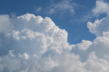 Wonderful fluffy Cumulus clouds in a beautiful, warm summer sky.
