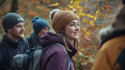 Fototapeta premium Happy hikers in a colorful autumn forest exploring nature together with smiles and warm clothing.