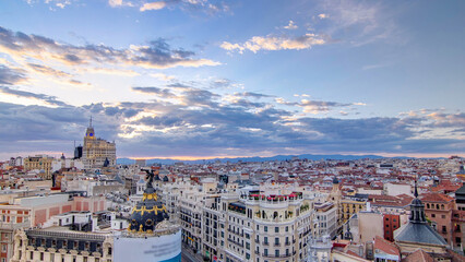 Fototapeta premium Panoramic aerial view of Gran Via timelapse before sunset, Skyline Old Town Cityscape, Metropolis Building, capital of Spain