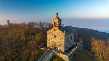 Church on Mount Ślęża at sunrise, bird's eye view, Lower Silesia, Poland.