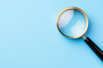Magnifying glass on light blue background. Science, information research, gathering and summarization, fact-checking concept