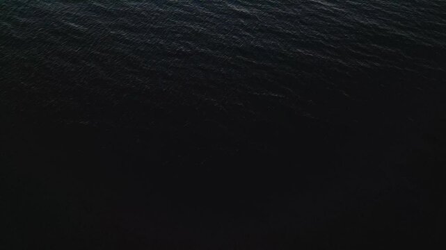 Revealing Drone Shot of the Ocean Tilting Up