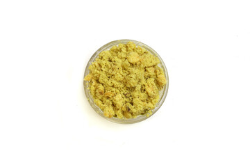 bowl with dry peanut powder on white background