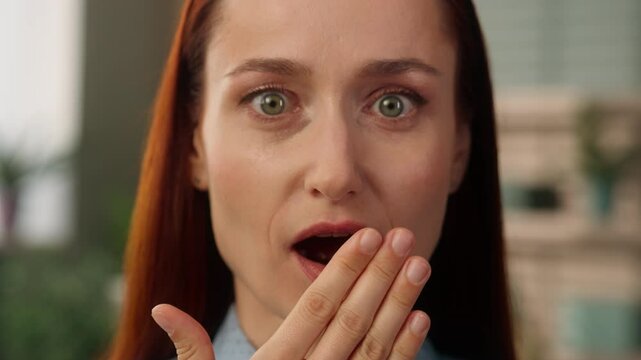 Caucasian woman shocked girl female businesswoman business woman close up wide open mouth scary fright impress face stare amazed wonder surprise wow news fear reaction shock emotion stunned expression