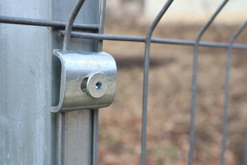 Detailed closeup image showcasing a Metal Fence Connector along with its Lock Mechanism