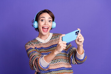Photo of glad cheerful lovely adorable woman wear trendy clothes use modern technology isolated on...