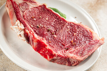 Raw beef steak meat fresh tasty food dish delicious gourmet food background on the table rustic food top view copy space keto and paleo diet