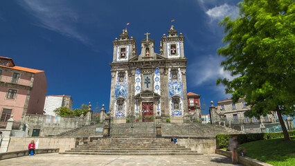 Church of Saint Ildefonso timelapse hyperlapse, covered with typical Portuguese tiles called...