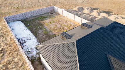 Aerial view of house roof top covered