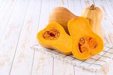 butternut pumpkin on a white table, selective focus.