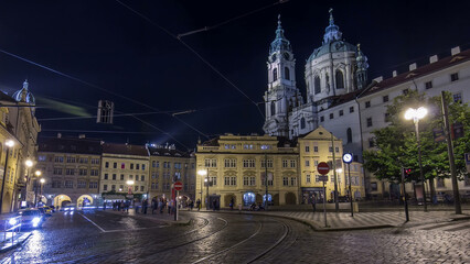 Fototapeta premium Night view of the illuminated malostranske namesti square timelapse hyperlapse in prague
