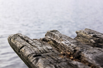  old wooden bench with a lake in the background
