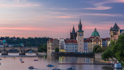Obraz premium View of the city Prague in Czech Republic day to night timelapse on the Vltava river with beautiful sky