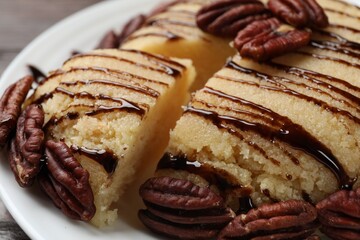 Delicious sweet semolina halva with pecans on table, closeup