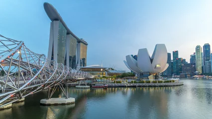 View of The Helix Bridge in Singapore day to night timelapse.