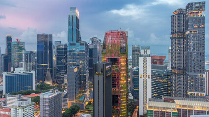 Fototapeta premium Aerial view of Chinatown and Downtown of Singapore day to night timelapse