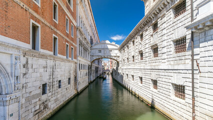 Gondolas floating on canal towards Bridge of Sighs timelapse. Venice, Italy