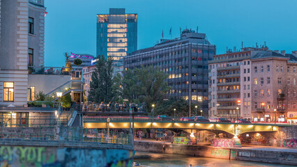 Fototapeta premium Vienna cityscape with the Danube channel day to night timelapse in Vienna. Austria.