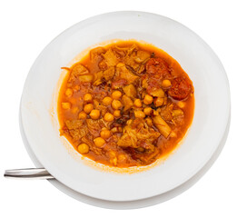 Spanish stew of chickpeas, pork, tomatoes with garlic and chorizo sausages. Traditional Catalan dish Callos con garbanzos on a white plate. Isolated over white background