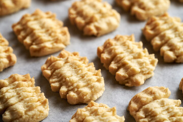 Freshly baked homemade Christmas cookies on a baking sheet, closeup