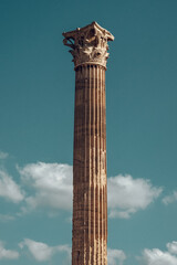 Ancient Corinthian Column with Intricate Design Against a Clear Blue Sky