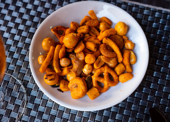 Crispy spanish snack tapas on plate served for beer snack