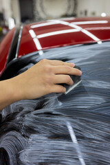 Car Detailing Meticulously Cleaning Your Windshield with Care for an Immaculate Appearance