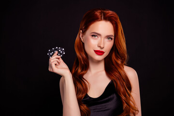 Photo of fashionable gorgeous rich glamour lady hollywood hold casino cards dress isolated on black...