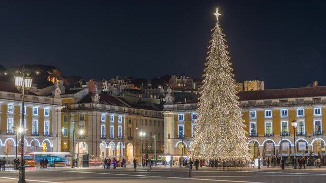 Commerce Square in Lisbon illuminated at Christmas hyperlapse, with a towering tree and crowds celebrating at night. Timelapse of the festive atmosphere decorations and historic architecture on a hill