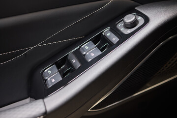 Naklejka premium Modern Car Door Control Panel with Window Switches for convenience and functionality