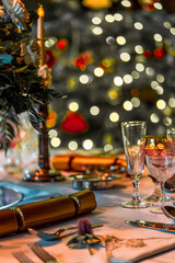 Elegant Holiday Season Table Setting with Festive Decorations and Bokeh Lights