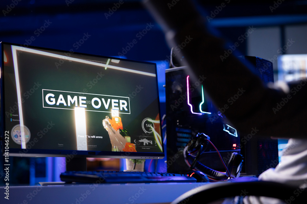 Aufkleber gamer throwing headphones in frustration after receiving game over screen in first person shooter. p