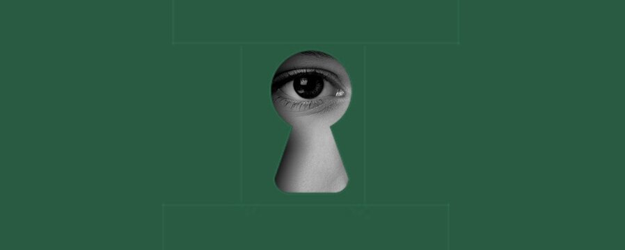 Female eye into keyhole on background. hidden truths.